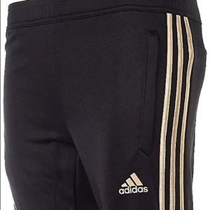 gold stripped adidas pants